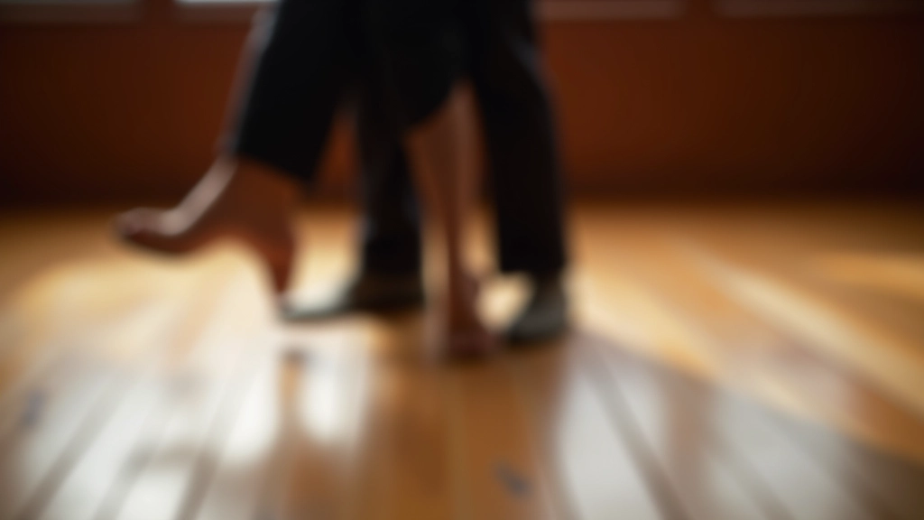 Close-up of feet and lower legs during a dance class, showing proper footwork positioning on a wooden dance floor